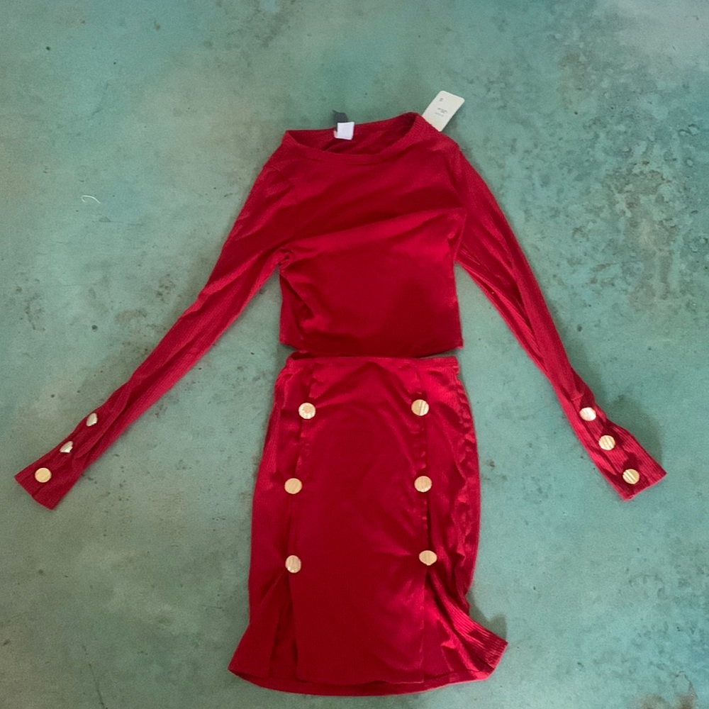 Im selling a two piece red outfit with gold buttons on both sleeves and skirt